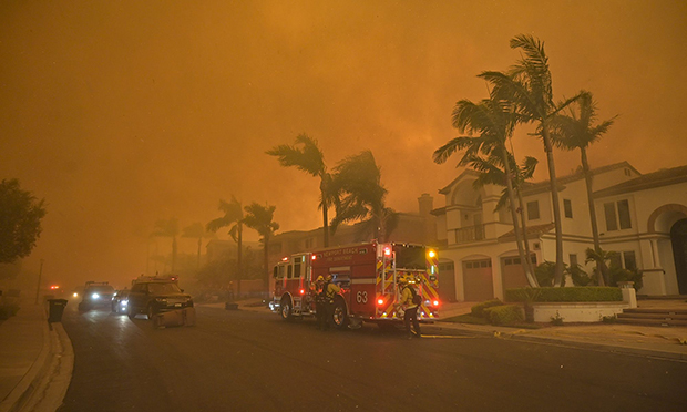 Firefighters battle the Coastal Fire near the intersection of Vista Montemar and Coronado Pointe in Laguna Niguel, California, on May 11, 2022. Photographer: Jeff Gritchen/MediaNews Group/Orange County Register/Getty Images
