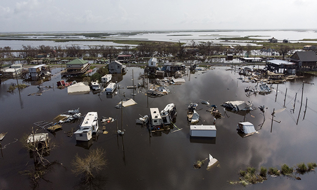 Damaged homes in floodwater after Hurricane Ida in Pointe-Aux-Chenes, Louisiana, on Sept. 2, 2021. Photographer: Mark Felix/Bloomberg