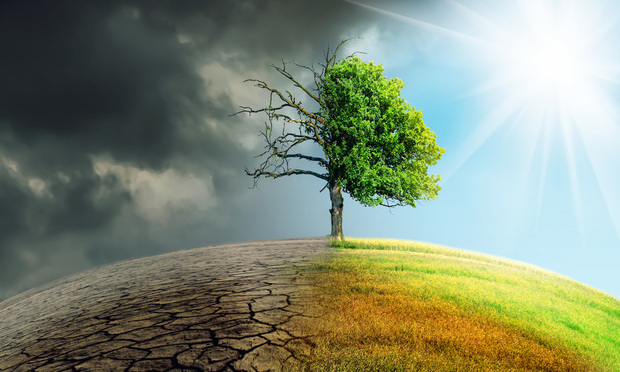 A tree stands on top of a hill. In the left side of the split frame, the sky is dark and polluted, the ground is cracked, and the tree is dead. On the right side, the sky is clear and blue, grass covers the hillside, and the tree is alive and well.