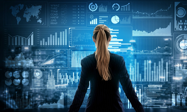 Women in front of data and charts