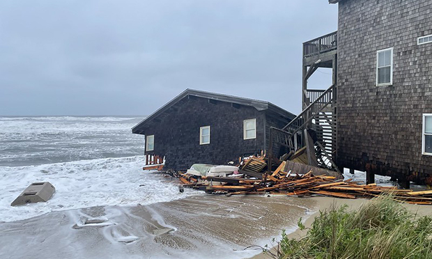 One of North Carolina homes that collaposed on May 10, partially submerged in sea water.