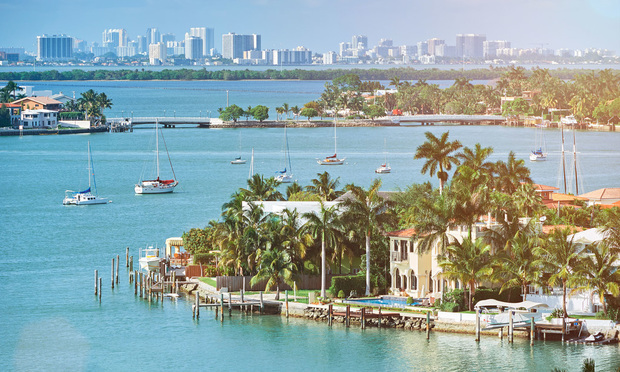 Waterfront houses in Miami, FL. Credit: Adobe Stock