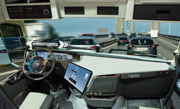 Behind the steering wheel of a semi-autonomous vechicle.
