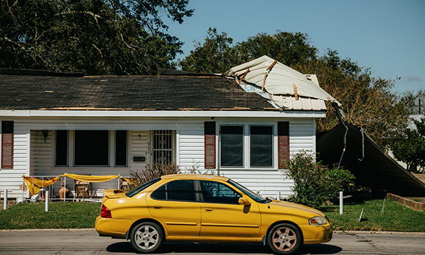 A home with a damaged roof stands after Hurricane Delta made landfall in New Iberia, Louisiana, U.S. Photographer: Bryan Tarnowski/Bloomberg