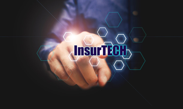 Insurance technology (Insurtech) concept and businessman pressing on text with virtual screen.