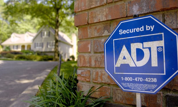 An ADT Security sign sits out in front of a home in Sandy Springs, Georgia Friday, May 11, 2007. Tyco bondholder American International Group Inc. this week sued the owner of ADT security systems in an effort to block it from buying back $6.6 billion of debt as part of a plan to split into three companies. Photographer: Chris Rank/ Bloomberg News.