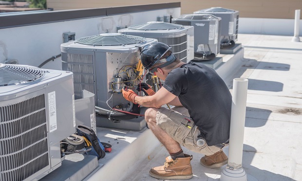 Contractor working on a residential HVAC system.