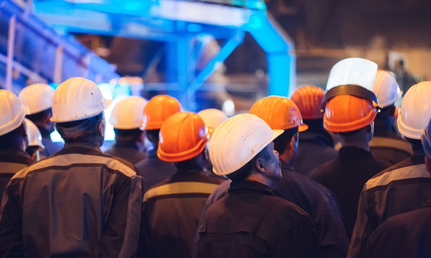 A group of people wearing hard hats