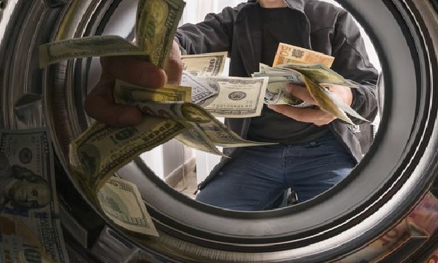 Interior of a dryer with money flying around.