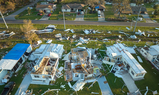 Hurricane Ian destroyed homes in Florida residential area. (Credit: bilanol/Adobe Stock)