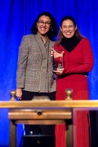 (left to right) IICF 2022 Benefit Dinner Chair Neeti Bhalla Johnson, president of global risk solutions at Liberty Mutual Insurance, presents Lucy Clarke, president of Marsh Specialty and Marsh Global Placement, with the Double I Award. Clarke accepted the award, which recognizes 