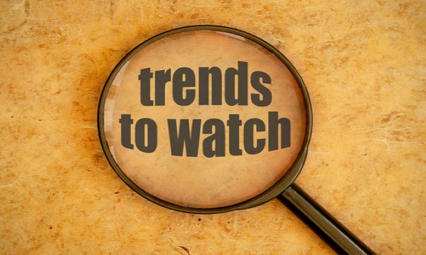 An illustration of a magnifying glass over the words "trends to watch."