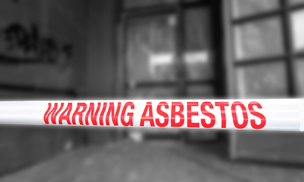CHRISTCHURCH - DEC 04 2015:Sign reads: Warning - Asbestos removal in progress.Inhalation of asbestos fibers can cause serious and fatal illnesses including lung cancer, mesothelioma and asbestosis.