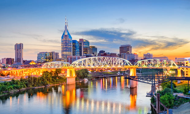 Nashville, Tennessee, USA downtown skyline on the Cumberland River.