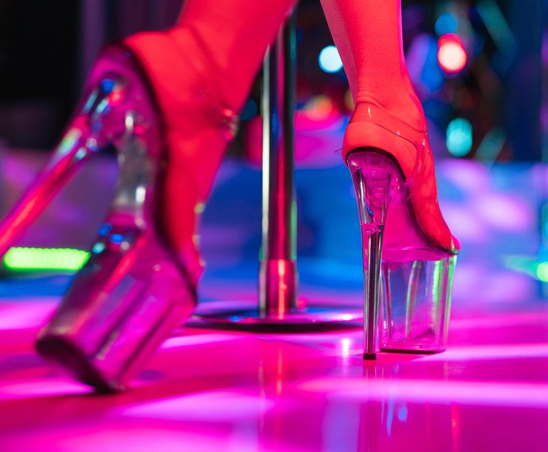 The coverage dispute started when a group of models sued three Texas strip clubs for using their images in advertisements without consent. They claimed the ads implied the models endorsed or worked at those clubs. Credit: Aleksandr Rybalko/Shutterstock.com