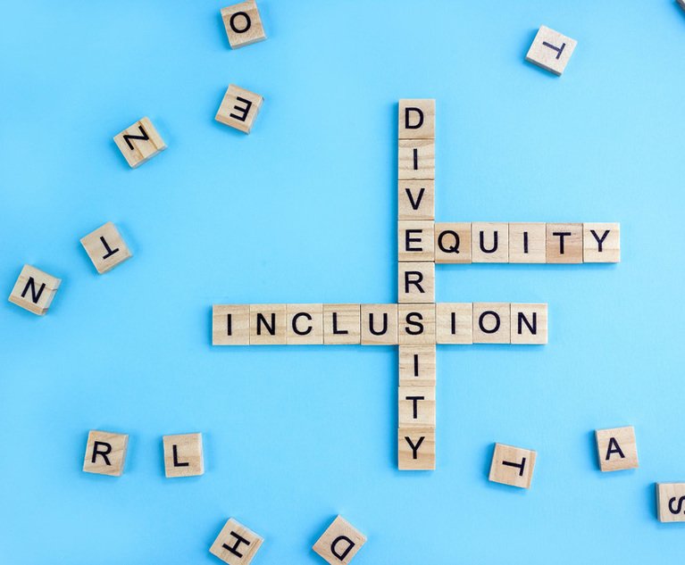 Intersecting scrabble tiles that spell out "diversity" "equity" and "inclusion"