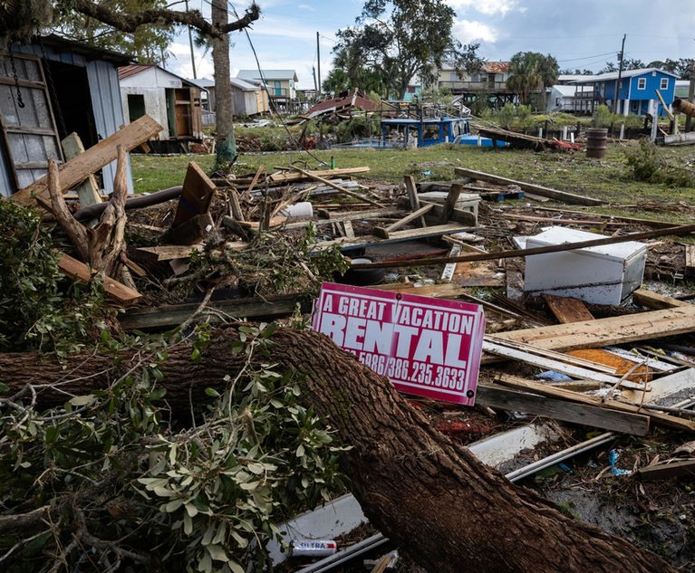 A vacation rental sign in the rubble of a damaged home after Hurricane Idalia made landfall in Horseshoe Beach, Florida, US, on Wednesday, Aug. 30, 2023. Hurricane Idalia has knocked out power to hundreds of thousands of customers, grounded more than 800 flights and unleashed floods along Florida's coast far from where it came ashore as a Category 3 storm August 30, 2023.