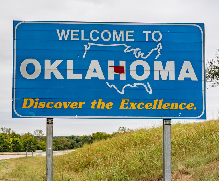 Welcome to Oklahoma sign along highway.