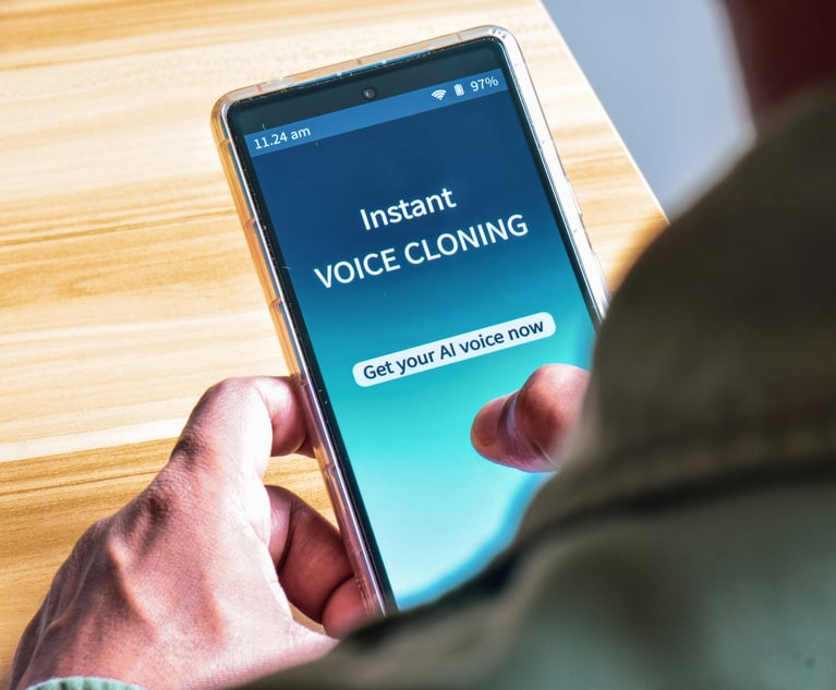 A person holding a phone while using a voice cloning application