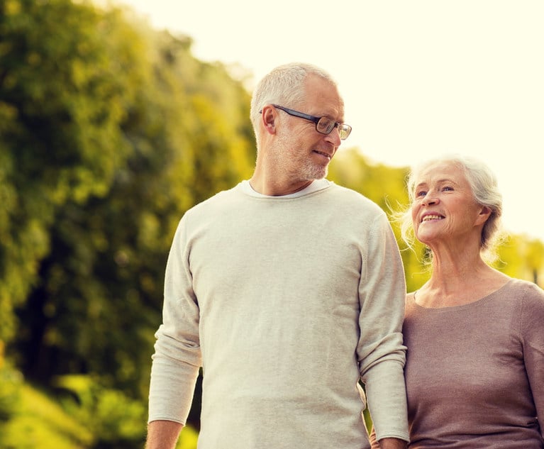 An elderly couple walking together