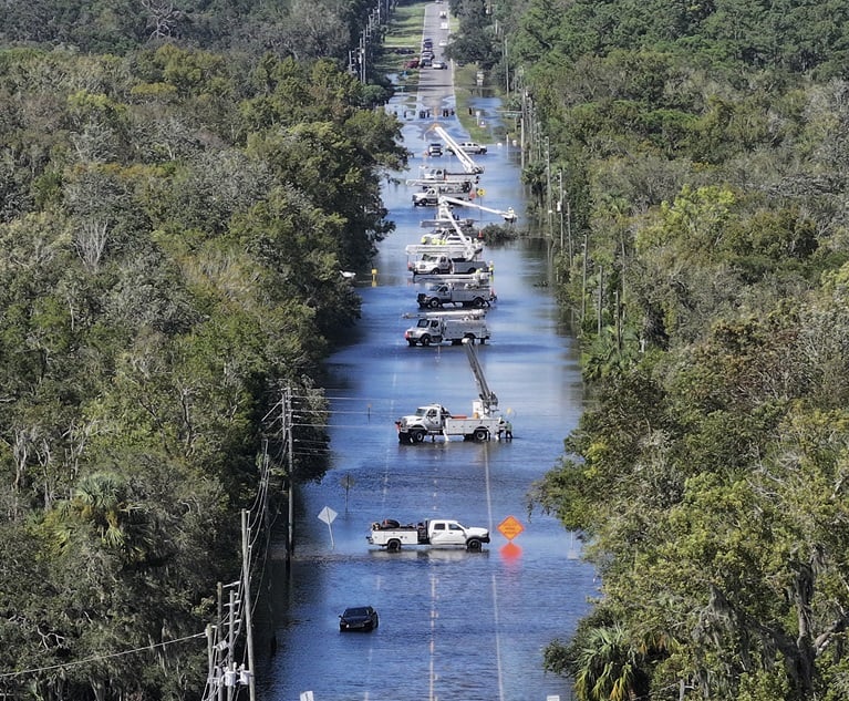 Power crews work on the lines after Hurricane Helene passes in Crystal River, Florida, on Sept. 27. (Photo credit: Joe Raedle/Getty Images via Bloomberg)