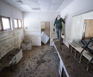 A search and rescue team member inspects a building in the aftermath of Hurricane Helene in Bat Cave, North Carolina, on Oct. 1. (Credit: Sean Rayford/Getty Images/Bloomberg)