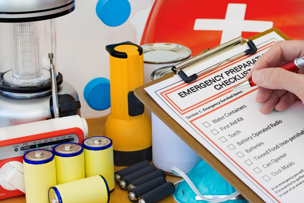https://images.propertycasualty360.com/propertycasualty360/article/2015/04/22/hand-completing-emergency-kit-checklist-ss-pixsooz.jpg